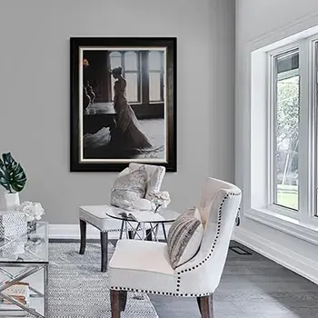 Art consultant for interior designers - bright room setting with a painting of a lady with a long dress on